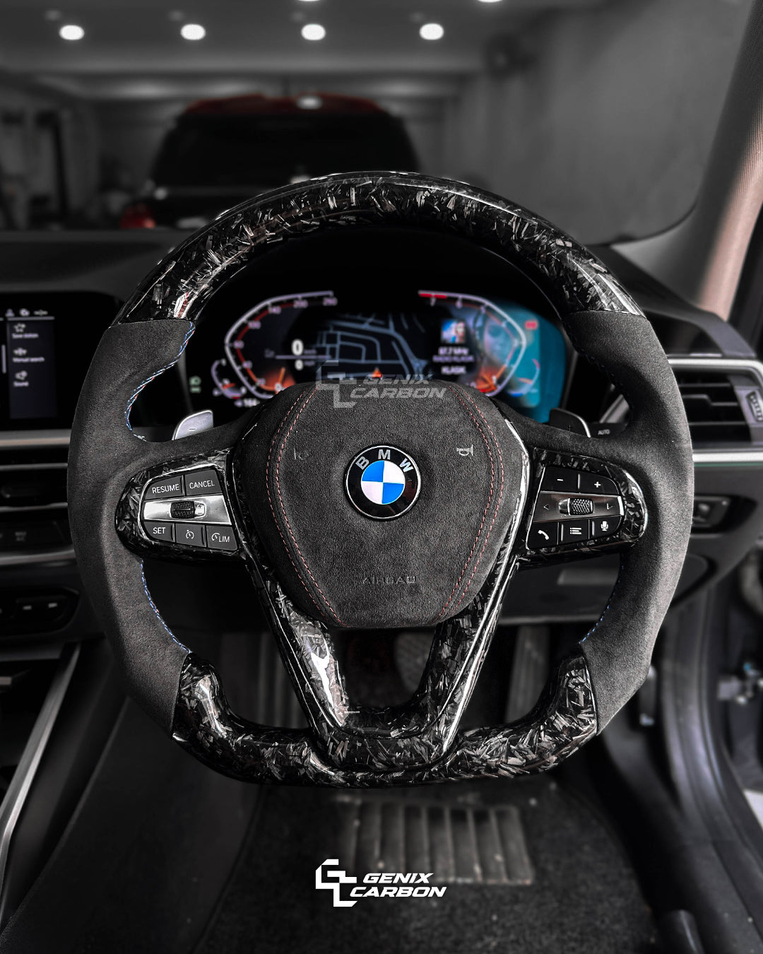 BMW Forged Carbon fiber steering wheel in a car interior, featuring 'Genix Carbon' branding.
