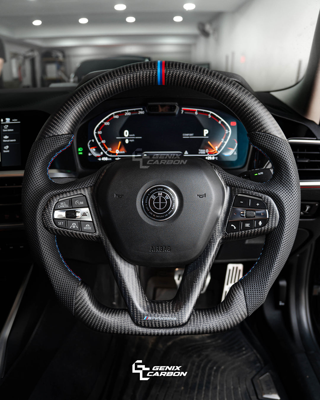BMW Matte Carbon fiber steering wheel in a car interior, featuring 'Genix Carbon' branding.