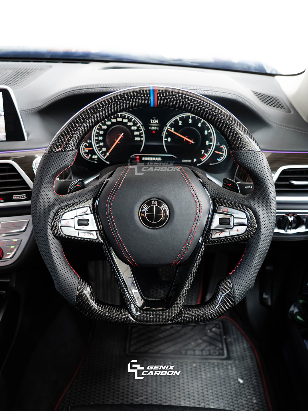 BMW Gloss Carbon fiber steering wheel in a car interior, featuring 'Genix Carbon' branding.