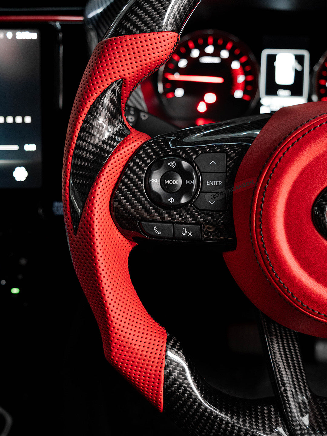 Alcantara side grip on carbon steering wheel.