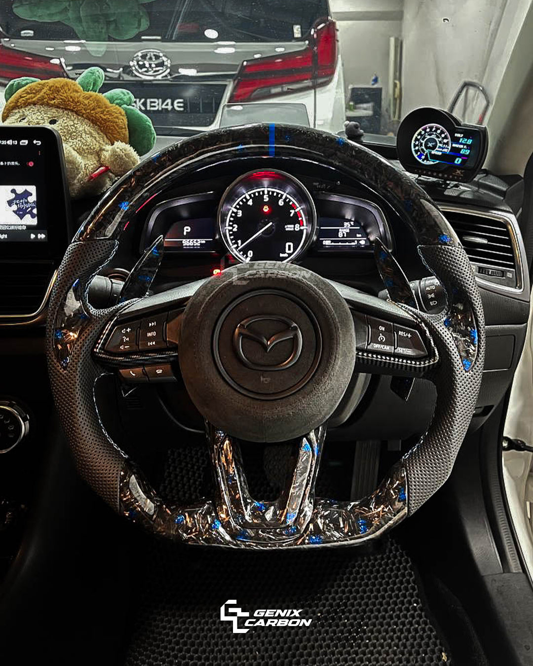 GENIX CARBON Mazda customizable forged carbon infused blue fiber steering wheel.