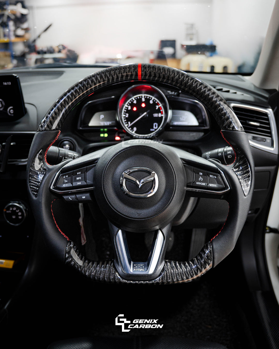 Mazda customizable carbon fiber steering wheel. Featuring 'Genix Carbon' branding.