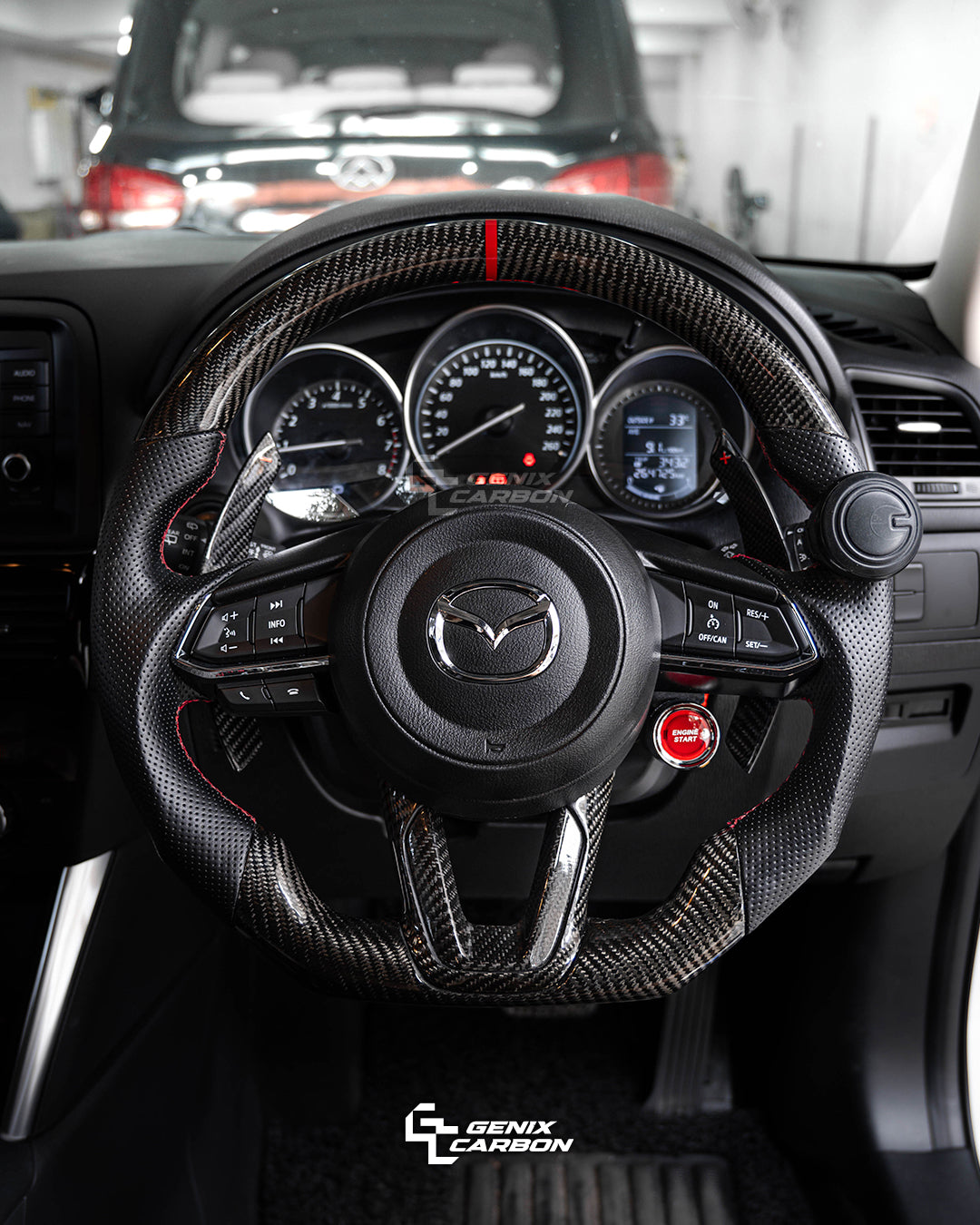 Mazda customizable carbon fiber steering wheel. Featuring 'Genix Carbon' branding.