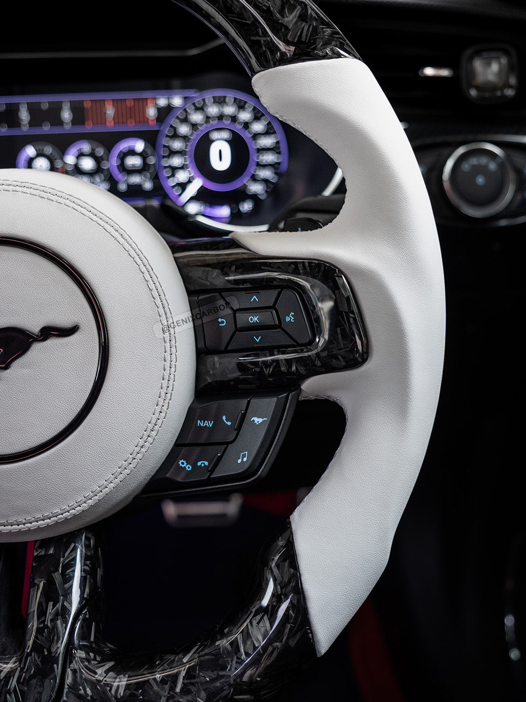 Nappa leather side grip on carbon steering wheel.